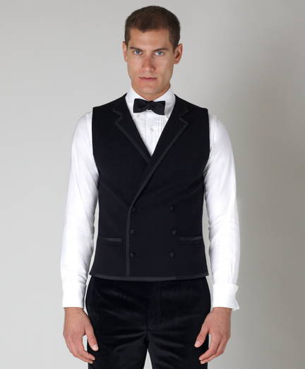 Pure merino wool. Tipped in black grosgrain with covered buttons. Dry clean. Imported.