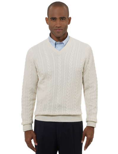 Pure cashmere spun and dyed in Scottland. Knitted at one of the oldest Scottish knitters in existence. Sweaters are washed in water from the River Tweed for added softness. Each sweater is hand-finished. V-neck body with classic cable. Fully fashioned. Hand wash or dry clean. Imported.