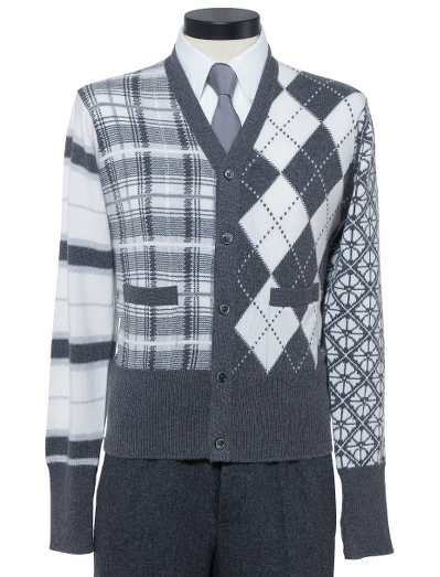 Pure handknit Scottish cashmere. Mother-of-pearl buttons. Button cuff with grosgrain on sleeve and placket. Locker loop at back neck. Dry clean. Made in Scotland.