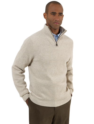 Pure Scottish lambswool. Classic rib stitch. Genuine leather zipper pull. Contrast tipping on inside neck. Fully fashioned. Dry clean. Imported.