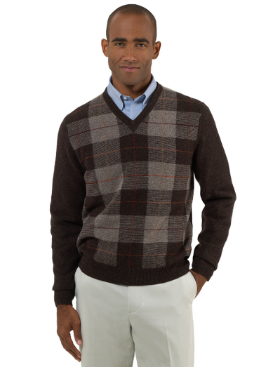 Pure Scottish lambswool. Classic v-neck body in a multi color plaid pattern. Fully fashioned. Dry clean. Imported.