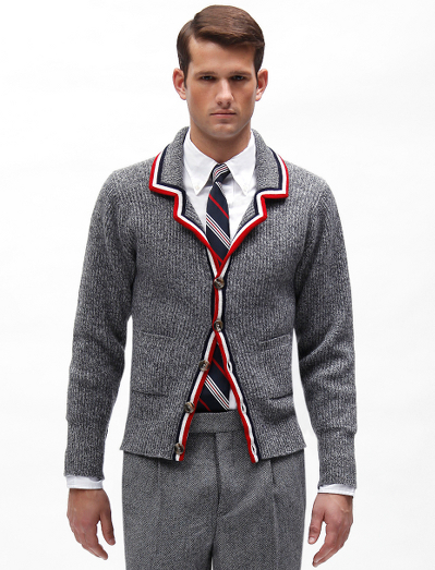 Pure Scottish cashmere. Mother-of-pearl buttons. Button cuff with grosgrain on sleeve and placket. Locker loop at back neck. Dry clean. Made in Scotland.