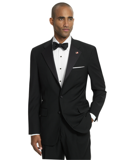 Pure wool. Notched lapel. Pleated trouser. Dry clean. Made in the USA.