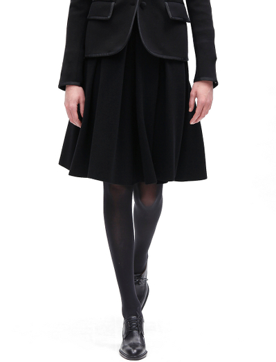 Pure merino wool with a grosgrain waistband. Zipper closure. Dry clean.