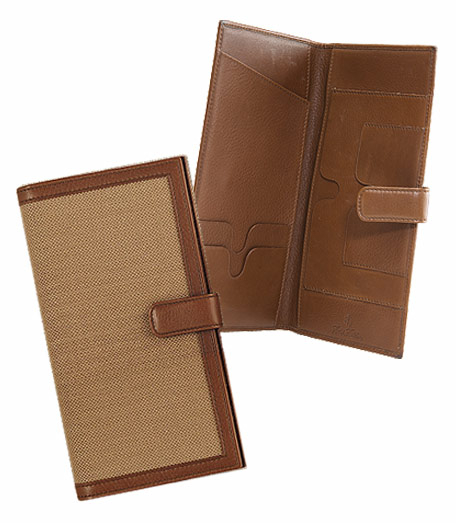 Distinctive accessories crafted and trimmed in genuine leather from Florence, Italy. Overlaid with oxford cloth inspired by the famous Brooks Brothers oxford cloth shirt. Seven compartments for travel necessities. Leather snap closure. 8" x 4 1/2".