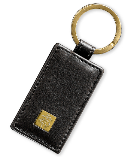 Distinguished accessories crafted in genuine leather from Florence, Italy. Lined in navy Golden Fleece jacquard. Brass hardware. 2 1/2" x 1 1/2". Made in Italy.