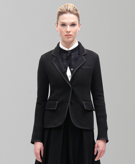 Pure merino wool. Black grosgrain trim and covered buttons. Dry clean. Imported.