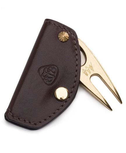Solid brass divot repair tool with leather case. 3 1/4" X 1 1/2". Imported.