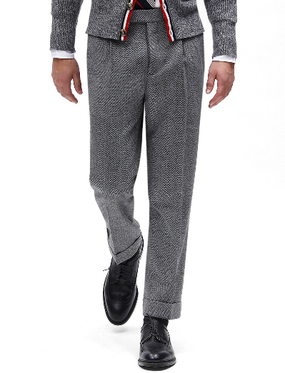 Pure wool herringbone. 100% Bemberg signature stripe lining. Button fly. Genuine horn buttons. Unfinished hem. Can be finished as seen or with a cuff and no break.  Dry clean only. Made in the USA.