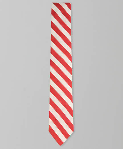 Silk and cotton from Italy. 2 1/4" width. Grosgrain trim at neck. Made in the USA.