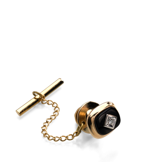 14KT gold. Genuine diamond and black onyx. Made in the USA.