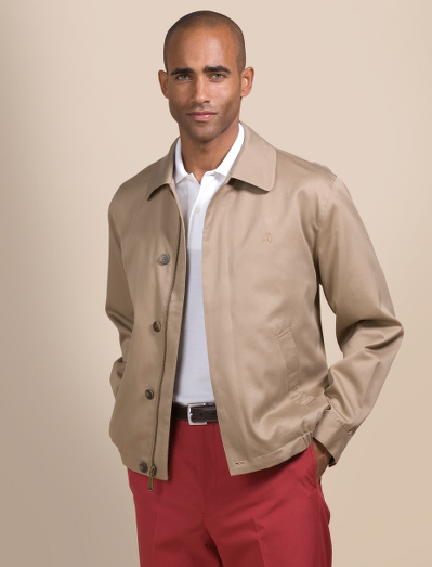 100% cotton. Full zip with signature plaid lining. Short-waisted, elastic bottom. Exterior slash pockets. Button sleeve cuffs. Interior horizontal pocket. Water repellent. Dry clean. Imported.