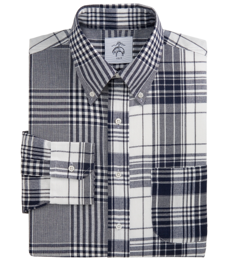 Pure cotton.  Button-down collar. Mitered cuffs.  Side gussets. Mother-of-pearl buttons. Locker loop at back neck. Machine wash. Made in the USA.