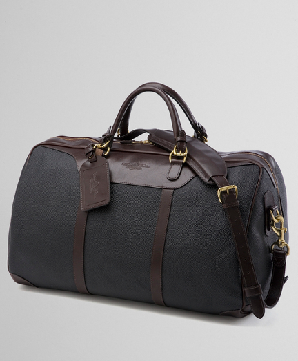 Black pebble with brown leather trim. Black nylon lining, water-resistant. Brass hardware. Tone-on-tone stitching. Padded shoulder strap. 21" x 14" x 12".