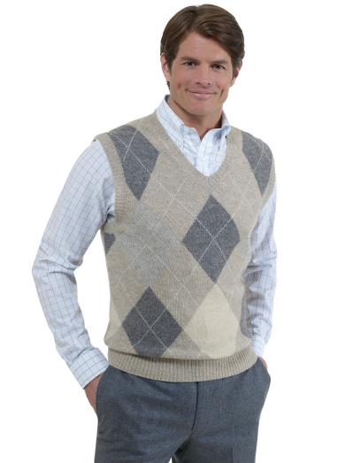 Luxuriously soft baby camel hair in a natural color. Classic v-neck vest style in an updated argyle pattern. Fully fashioned. Imported.