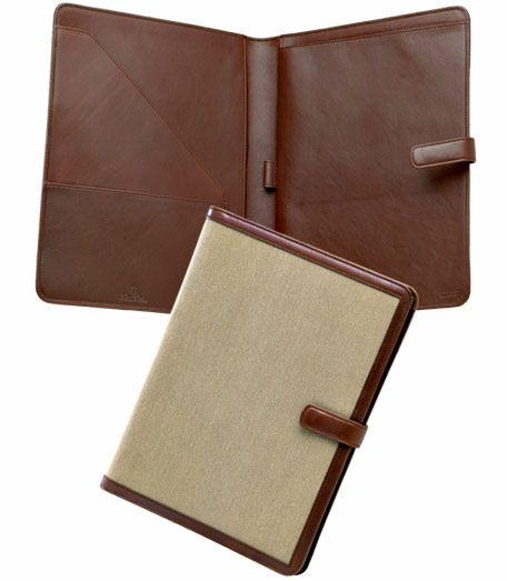 Distinguished accessories trimmed in genuine leather from Florence, Italy and overlaid with durable canvas oxford inspired by the famous Brooks Brothers' oxford shirt. Lined in genuine leather. Computer bag is lined with navy Golden Fleece logo jacquard lining. Brass hardware. Made in Italy. 12"l x 9 1/2"w.