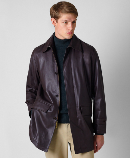 Genuine lambskin, Lined in 100% Bemberg. Stand collar. Three-fourths length. Zip-front and hidden button closure. Double vents at back.  Professional leather clean only. Imported.