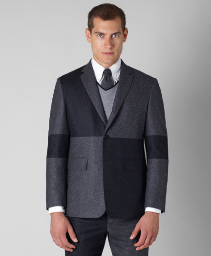 Pure wool flannel. Three-button jacket with double back vent. Genuine horn buttons. Locker loop at back neck. Jacket sleeves are lined in Bemberg and unfinished; signature cuff is two button holes. Full canvas construction. Lined in striped cotton and modal blend. Dry clean. Made in the USA.