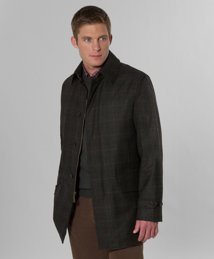 Walking in Loro Piana� Storm System wool woven in Italy. Three-fourths length. Zip and button front. 100% twill Bemberg lining. Dry clean. Imported.