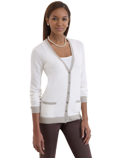 Cotton. V-neck. Mother-of-pearl buttons. Natural color trim on placket, cuffs and hem. Two front pockets. Ribbed trim. Dry clean only. Imported.