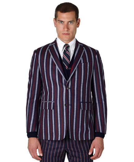 Pure lambswool. Three-button jacket with double back vent. Genuine horn buttons. Locker loop at back neck. Jacket sleeves are lined in Bemberg and unfinished; signature cuff is two button holes. Full canvas construction. Locker loop at back neck. Lined in striped cotton and modal blend. Dry clean. Made in the USA.