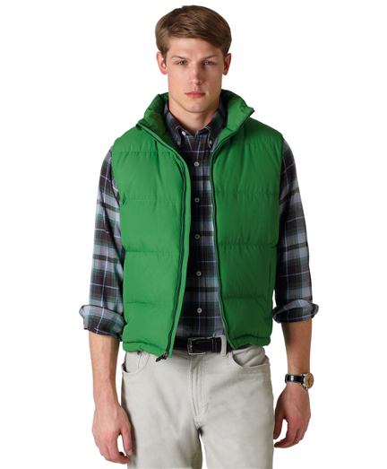 Nylon lined in a fun cotton plaid. Zip front. Machine wash. Imported.