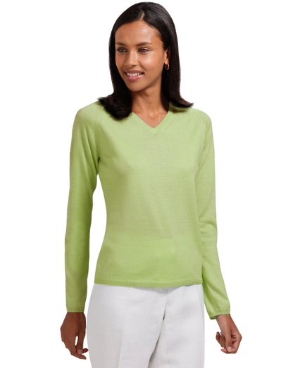 Merino/silk. V-neck. Raglan sleeve. Ribbed trim at neck, cuff and hem. Dry clean. Imported.