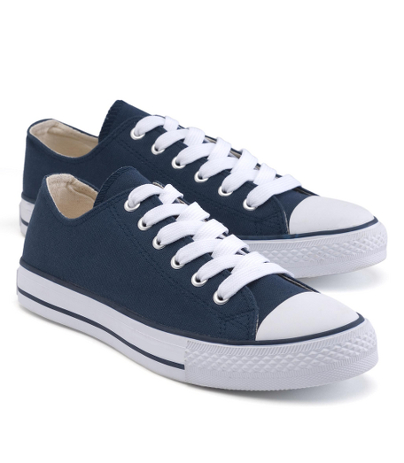 Classic sneaker style in cotton canvas. Rubber toe and sole. Imported.