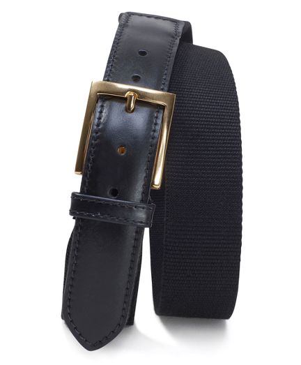 Canvas webbed belt with cordovan tabs and brass buckle. 1 1/4" thick. Made in canada