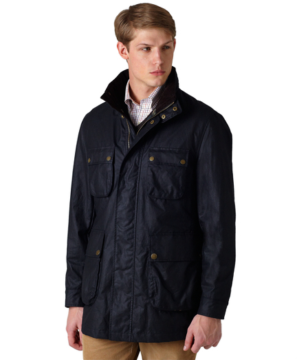 Authentic waxed cotton with corduroy collar plaid lining. Zip and snap front closure. Zip-out hood.Action back for added comfort. Multiple pockets for storage. Comes with a tin of oilcloth wax to extend and enhance water resistance. To clean, brush off soil, sponge fabric with cold water and hang dry. Imported.