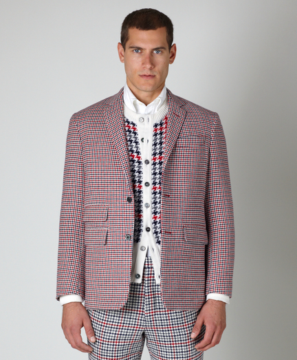 Pure wool. Three-button jacket with center back vent. Genuine horn buttons. Ticket pocket and locker loop at back neck. Jacket sleeves are lined in Bemberg and unfinished; signature cuff is two button holes. Full canvas construction. Lined in striped cotton and modal blend. Dry clean. Made in the USA.