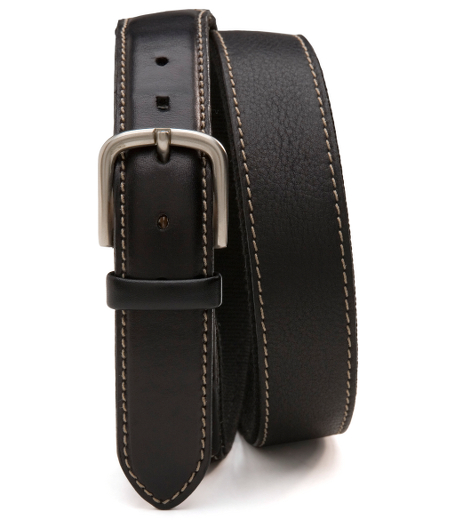 Vachetta leather with canvas backing. Silver-toned buckle. 1 1/4" thick. Made in Canada.