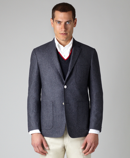 Pure wool flannel. Three-button, center vent with three patch pockets. Signature silver buttons. Locker loop at back neck. Jacket sleeves are lined in Bemberg and unfinished; signature cuff is two button holes. Full canvas construction. Lined in striped cotton and modal blend. Dry clean. Made in the USA.