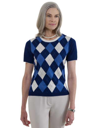 Extrafine Italian merino wool. Placed argyle. Contrast trim on neck, hem and sleeves. Crewneck. Dry clean. Imported.