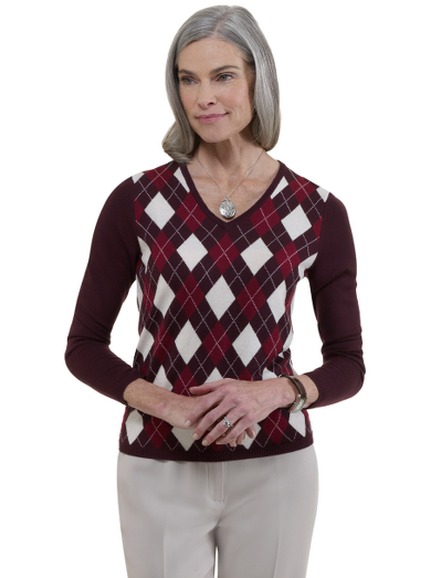 Extrafine Italian merino wool. V-neck with placed argyle. Rib trims. Dry clean. Imported.