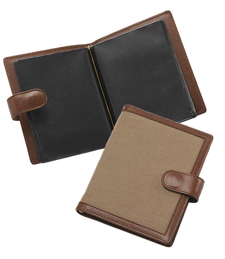 Distinctive accessories crafted and trimmed in genuine leather from Florence, Italy and overlaid with oxford cloth inspired by the famous Brooks Brothers oxford cloth shirt. 5" x 6 3/4".  Holds 36 pictures.
