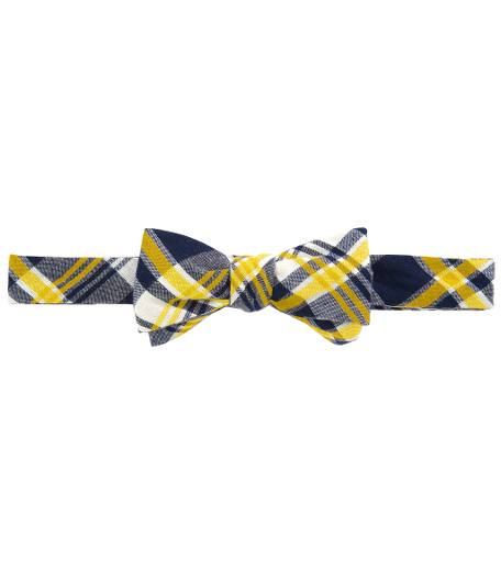 Cotton.  Self-tie bow.  Made in the USA.
