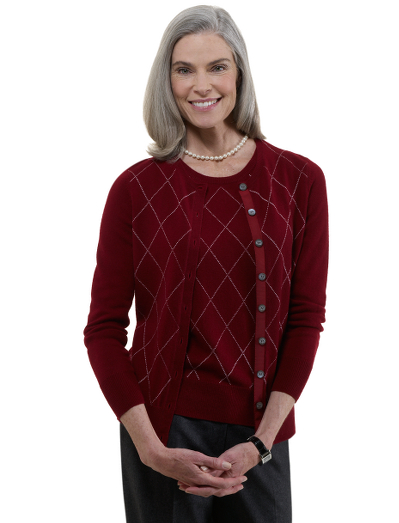 Cashmere crewneck with rib trim at neck, hem and cuffs. Placed argyle. Grosgrain trim on inside of front placket. Mother-of-pearl buttons with Country Club logo. Dry clean. Imported.