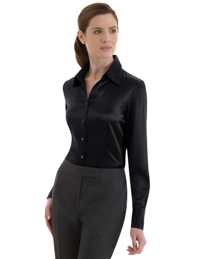 Silk charmeuse. A feminine silhouette with an elegant elongated neckline and forward point collar. Front and back princess seams. Mother-of-pearl buttons. Extended 4-button cuffs. Dry clean. Imported.