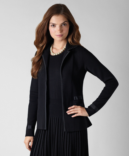Extrafine Italian merino wool. Grosgrain trim on cuff, pockets, placket and collar. Silver shank buttons. Dry clean. Imported.