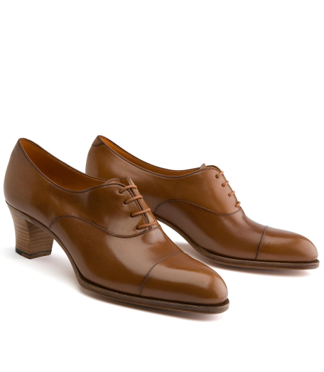 Calfskin. Handmade. Leather sole. 2" heel. Leather lined. Captoe detail with lace-up. Made in Spain.