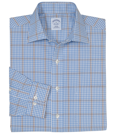 Pure cotton. Made with pucker-free seams and treated to remain virtually wrinkle-free. English collar. Superdurable logo buttons. Center back pleat and signature shirring at barrel cuffs. Left chest pocket. Machine wash. Imported. Also available in Traditional fit.