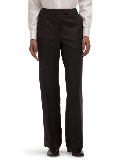 Wool super 120s. Plain front with contoured waistband. Tab front closure. Corozo buttons. Fully lined in Bemberg. Finished with a cuff. Front-slant pockets and back button through besom pockets. 32" inseam. Fabric woven in Italy. Dry clean. Imported.