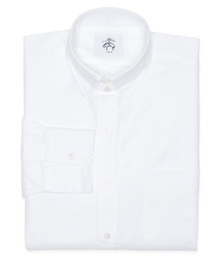 Pure cotton oxford. Tab collar. Mitered cuffs. Side gussets. Mother-of-pearl buttons. Locker loop at back neck. Machine wash warm. Made in the USA.