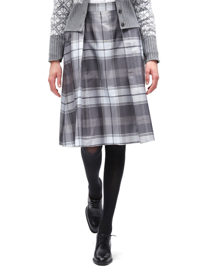 Pure silk in a tartan pattern. 100% Bemberg lining. Side zipper. Falls below the knee. Dry clean. Made in Italy.