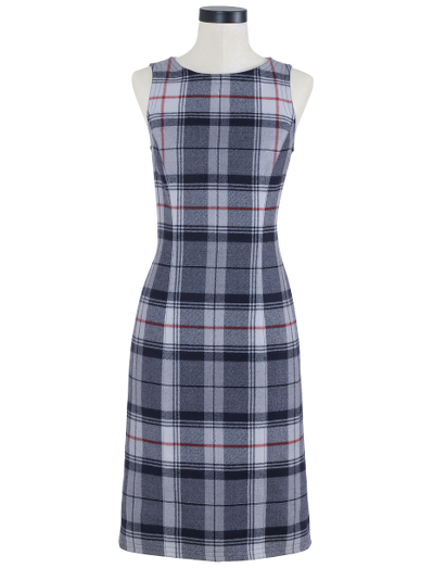 Pure wool in a tartan pattern. 100% Bemberg lining. Falls below the knee. Dry clean. Imported.