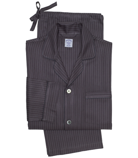 Pure luxurious silk. Classic pajamas comfortably styled. Mother-of-Pearl button-front notch collar top and drawstring bottom. Chest patch pocket and locker loop at neck. Machine wash. Imported.
