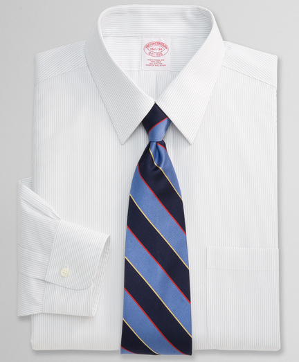 Pure cotton broadcloth. Pucker-free seams and treated to remain virtually wrinkle-free. Forward point collar. Center back pleat. Signature shirring at barrel cuffs. Machine wash. Imported. Also available in Slim fit.