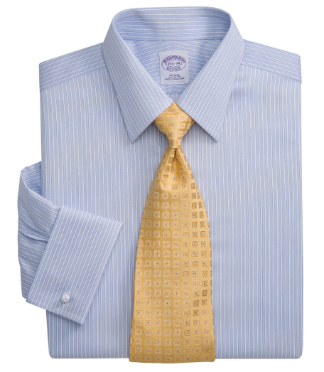 Pure Egyptian cotton made with pucker-free seams and specially treated to remain virtually wrinkle-free. Tennis collar. Signature shirring at French cuffs. French placket and chevroned split back yoke. Machine wash. Imported. Cuff links not included.