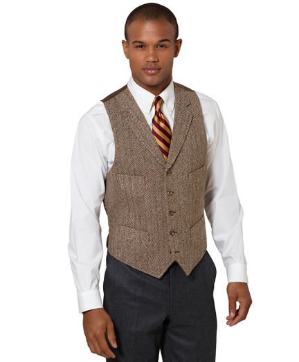 The perfect accent piece made of wool and woven in England. Five- buttons with lapels and four welt pockets. Dry clean. Imported.